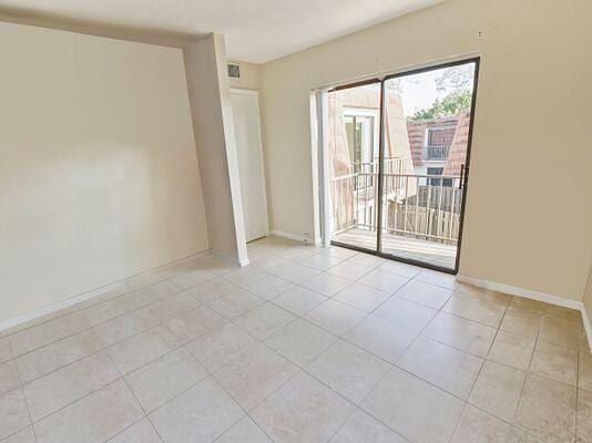 unfurnished room with light tile patterned floors