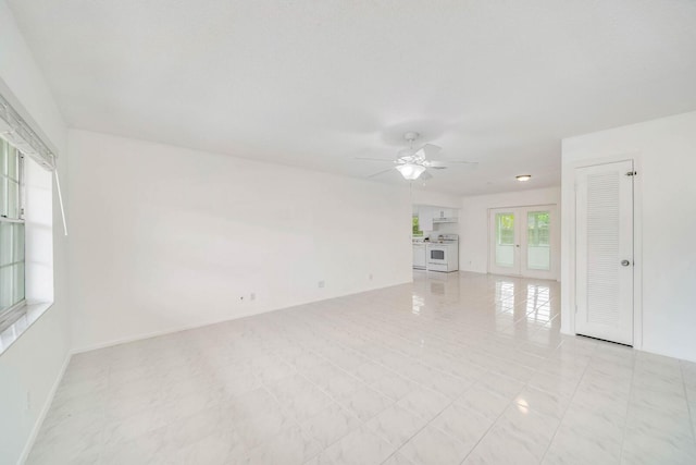 empty room with french doors and ceiling fan