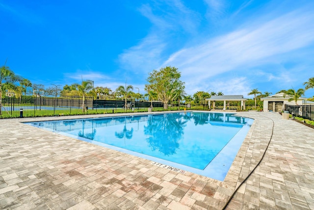 view of swimming pool featuring a gazebo, an outdoor structure, and a patio area