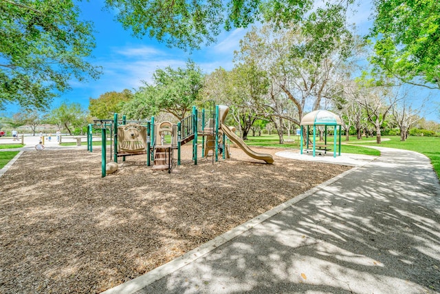 view of jungle gym featuring a lawn