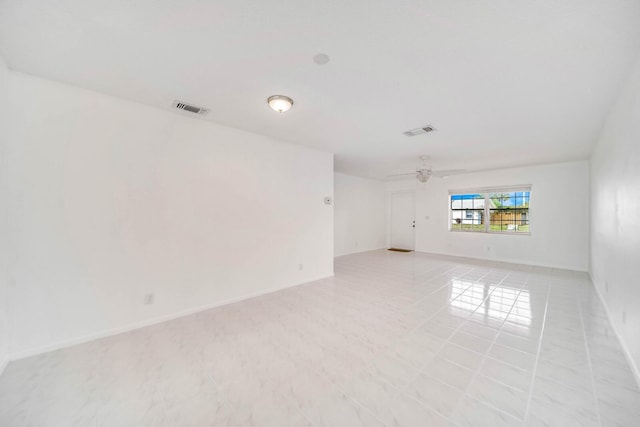 spare room with ceiling fan