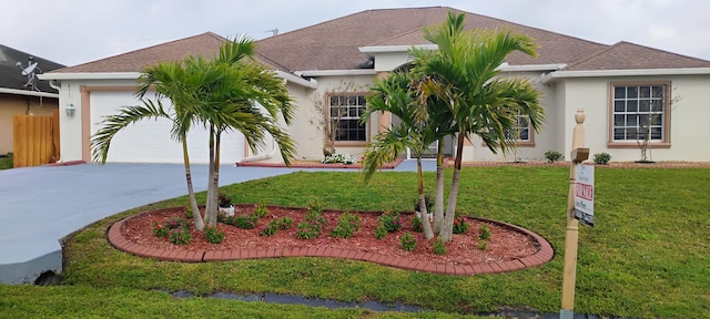 ranch-style home featuring a front lawn and a garage