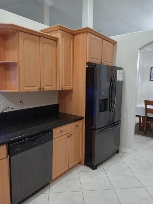 kitchen featuring light brown cabinetry, light tile patterned floors, and appliances with stainless steel finishes