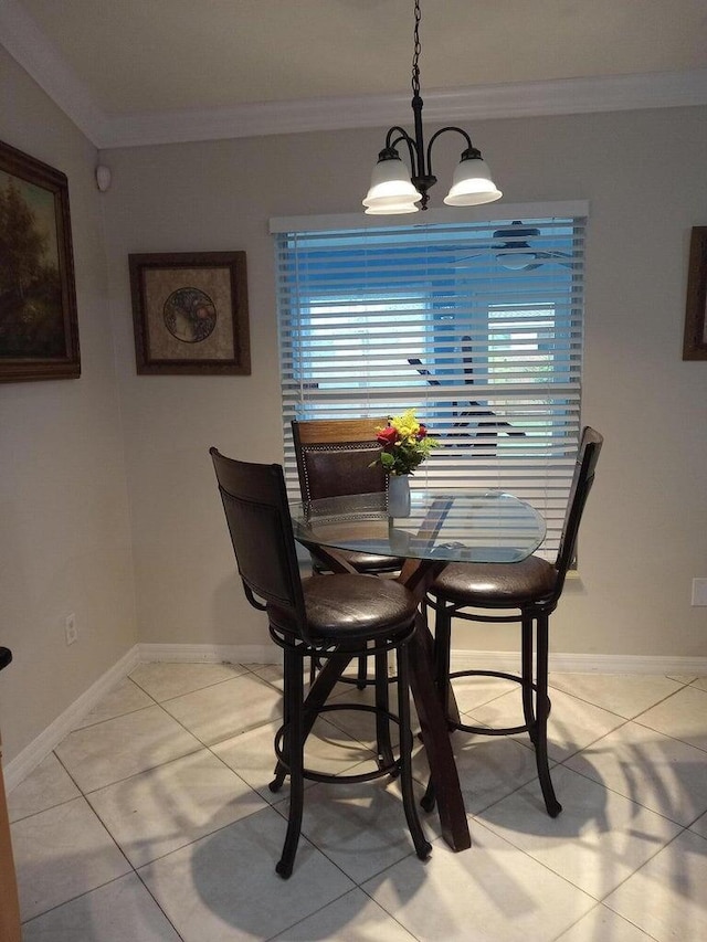 tiled dining area featuring a wealth of natural light, crown molding, and a chandelier