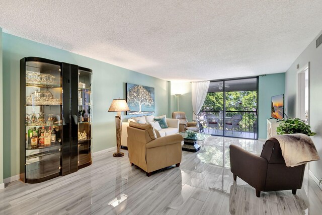 bedroom with a textured ceiling and light hardwood / wood-style floors