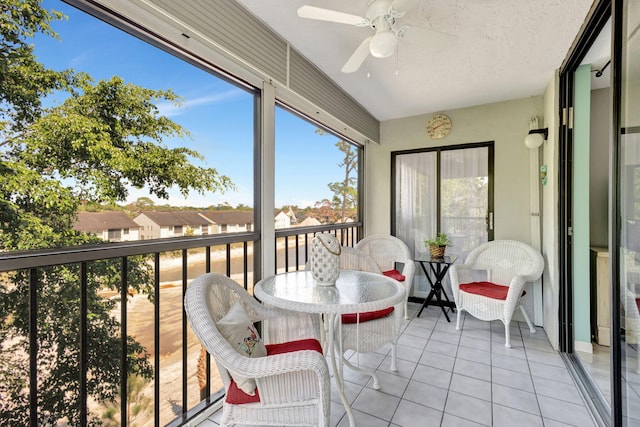 sunroom / solarium with ceiling fan