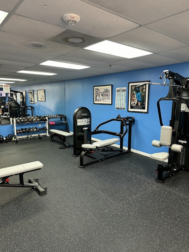 gym featuring a paneled ceiling