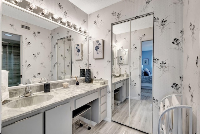 bathroom featuring vanity and wood-type flooring