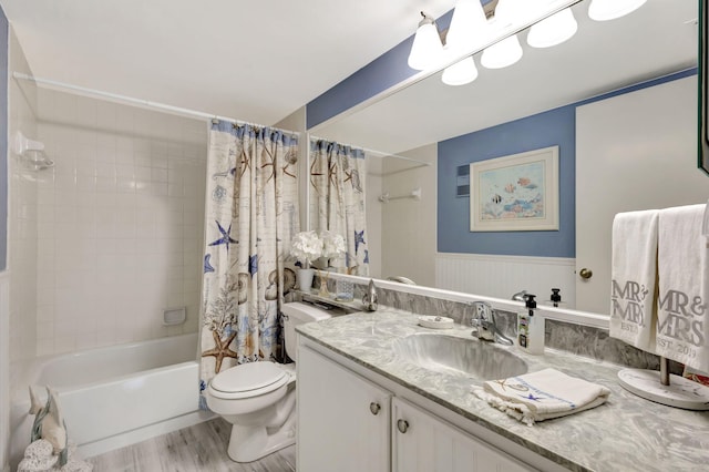 full bathroom with shower / bath combination with curtain, vanity, toilet, and hardwood / wood-style flooring