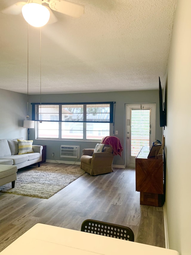 corridor featuring baseboards and wood finished floors