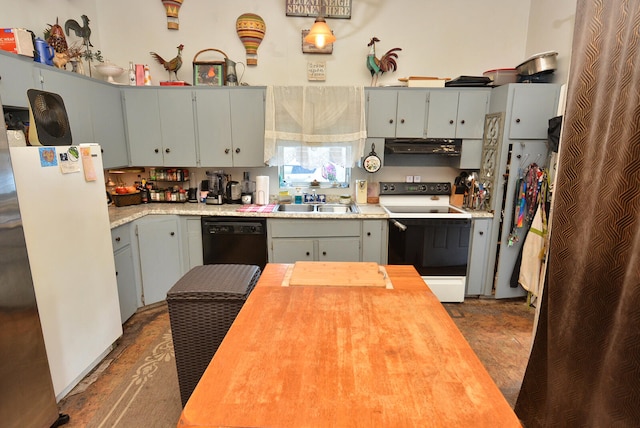 kitchen featuring ventilation hood, black dishwasher, sink, white fridge, and electric stove