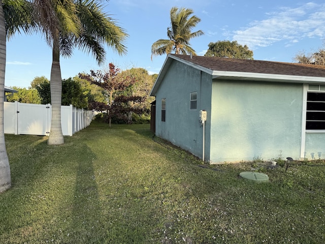 view of home's exterior featuring a lawn