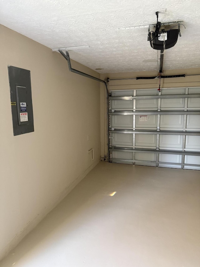 garage featuring electric panel and a garage door opener