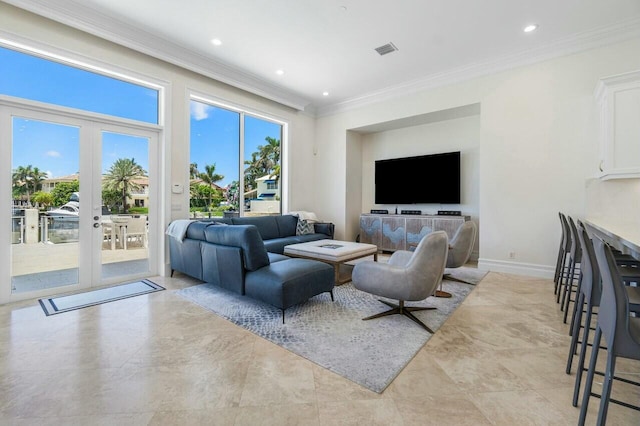 living room featuring crown molding and french doors