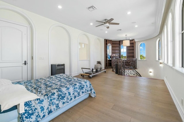 bedroom with light wood-type flooring and ceiling fan