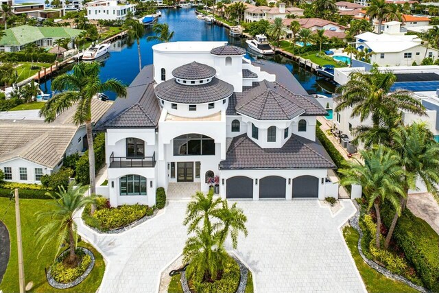 birds eye view of property with a water view