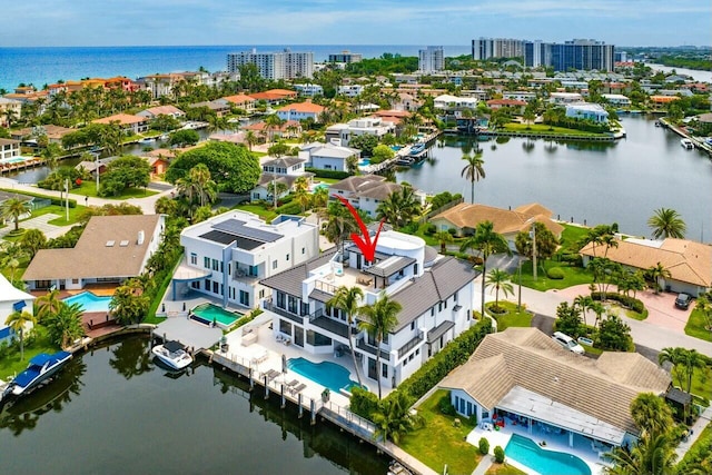 birds eye view of property with a water view