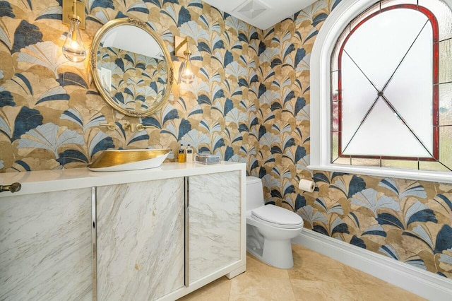 bathroom featuring toilet and tile patterned flooring