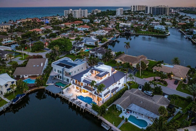 aerial view at dusk with a water view