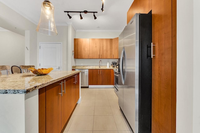 kitchen featuring decorative light fixtures, light tile patterned flooring, a center island, ornamental molding, and stainless steel appliances