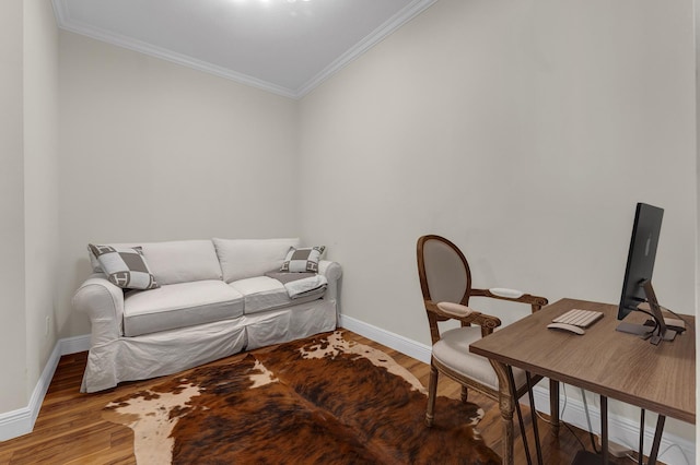 home office with ornamental molding and wood-type flooring