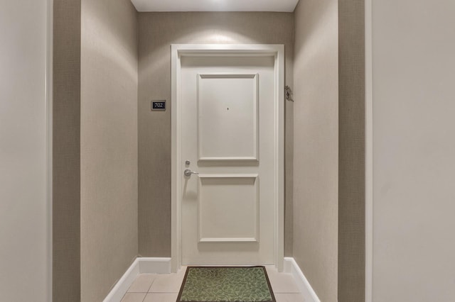 entryway with light tile patterned floors