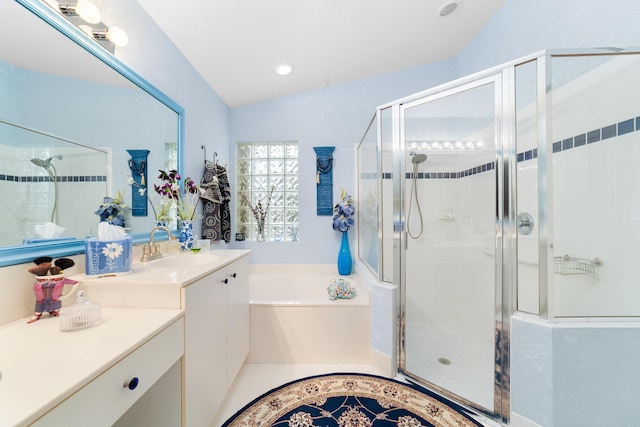 bathroom featuring tile patterned floors, plus walk in shower, vanity, and vaulted ceiling