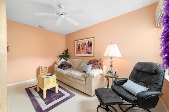 living room featuring ceiling fan and light tile patterned floors