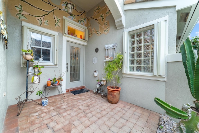 doorway to property featuring a patio area