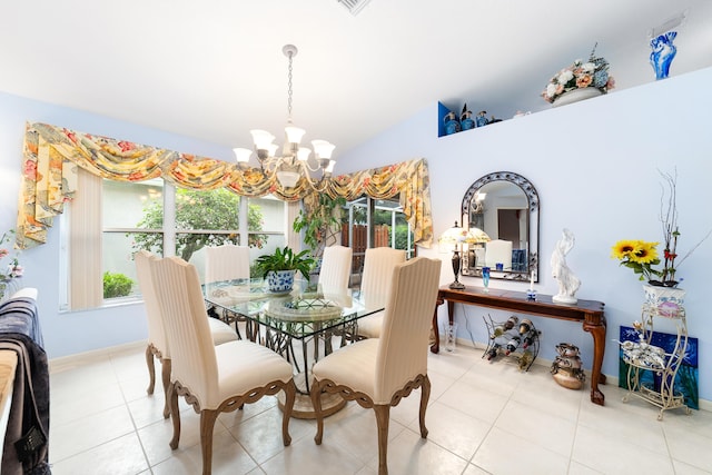 tiled dining area with lofted ceiling and a chandelier