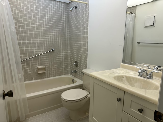 full bathroom with shower / bath combo with shower curtain, toilet, vanity, and tile patterned flooring