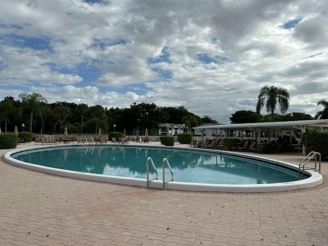 view of pool featuring a patio