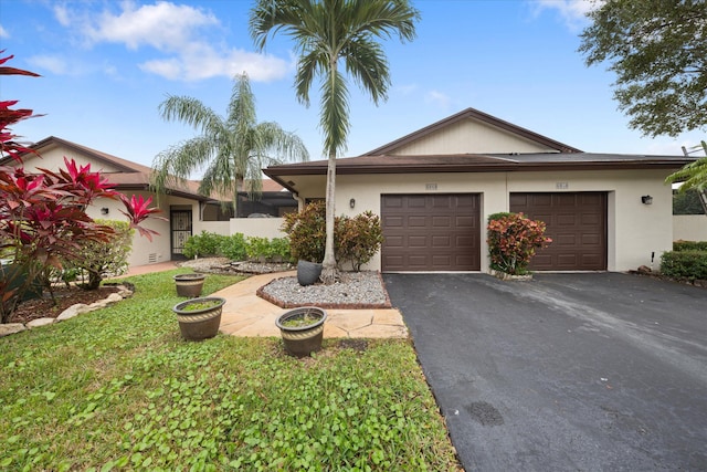 single story home featuring a garage