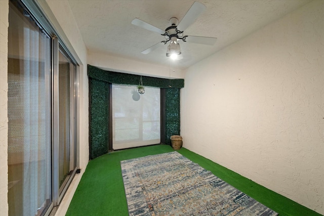 interior space featuring ceiling fan