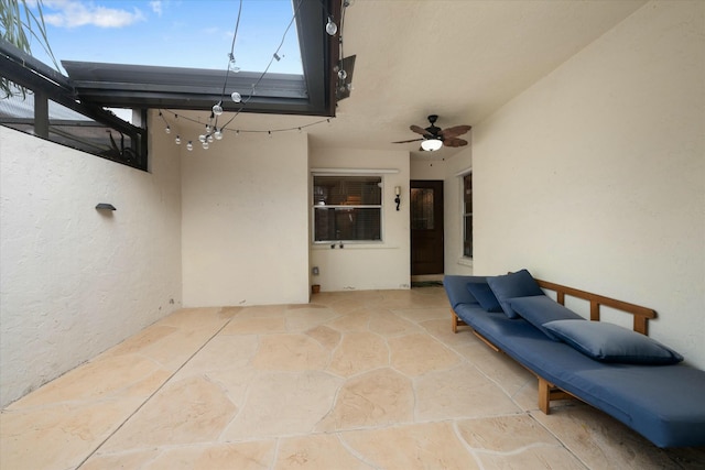 view of patio featuring ceiling fan