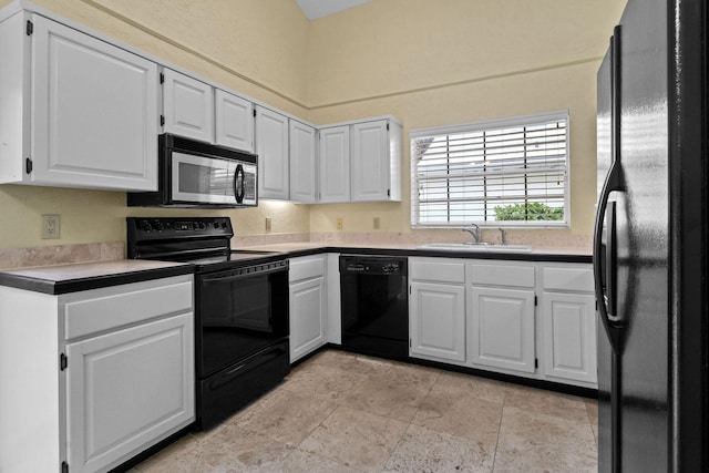 kitchen with sink, black appliances, and white cabinets