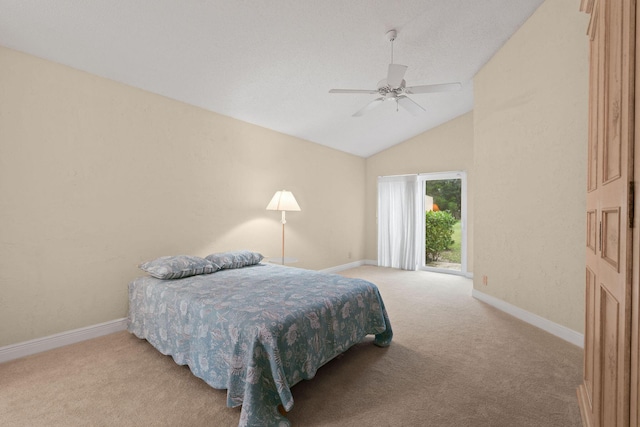 carpeted bedroom with ceiling fan and lofted ceiling