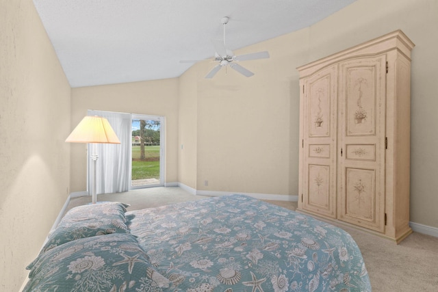 bedroom featuring vaulted ceiling, access to outside, light colored carpet, and ceiling fan