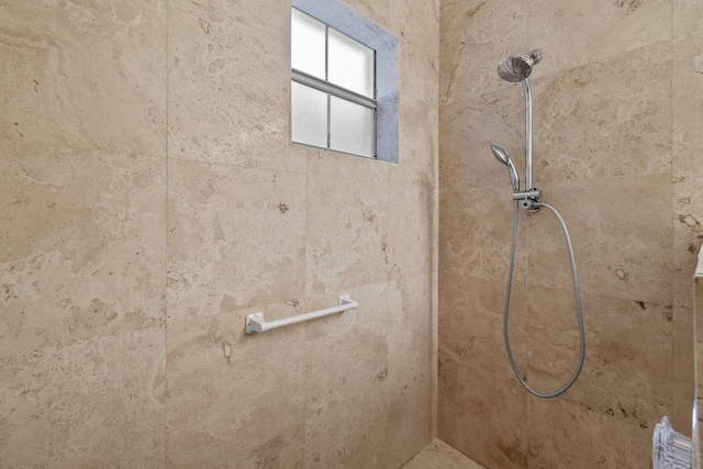 bathroom featuring tiled shower