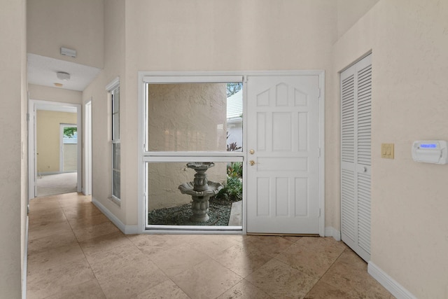 foyer entrance with a healthy amount of sunlight and a high ceiling