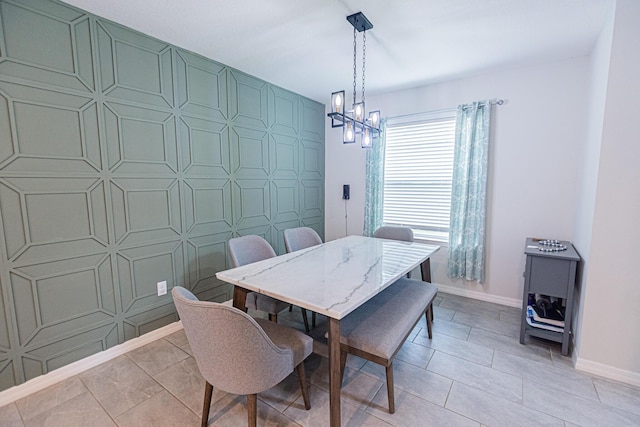 dining room featuring an inviting chandelier and light tile patterned floors