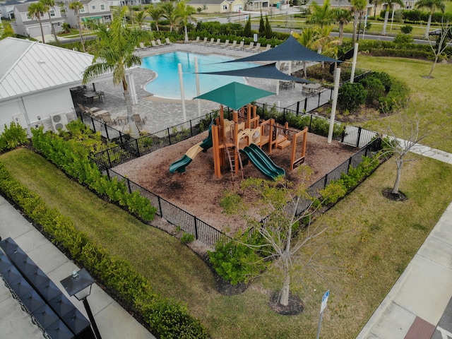 exterior space with a yard and a community pool