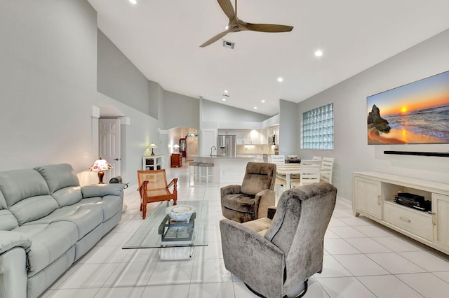 living area featuring visible vents, ceiling fan, light tile patterned floors, recessed lighting, and arched walkways