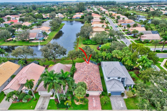 aerial view featuring a residential view and a water view