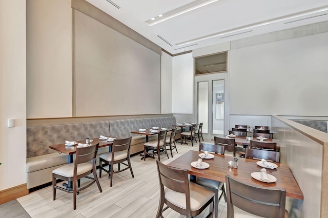 dining area with light hardwood / wood-style flooring