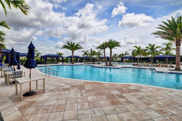 pool featuring a gazebo and a patio area