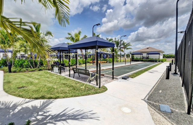 surrounding community featuring a yard and fence