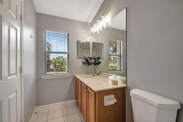 bathroom featuring toilet, tile patterned flooring, and vanity