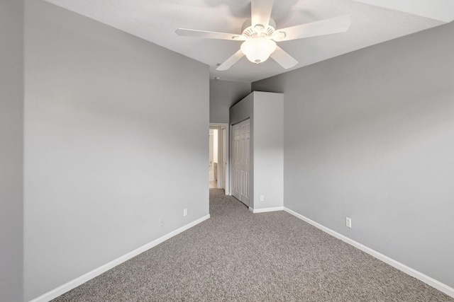 unfurnished room featuring carpet floors, ceiling fan, and vaulted ceiling