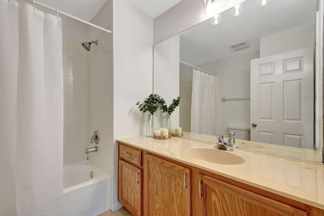 full bathroom with toilet, vanity, and shower / tub combo with curtain